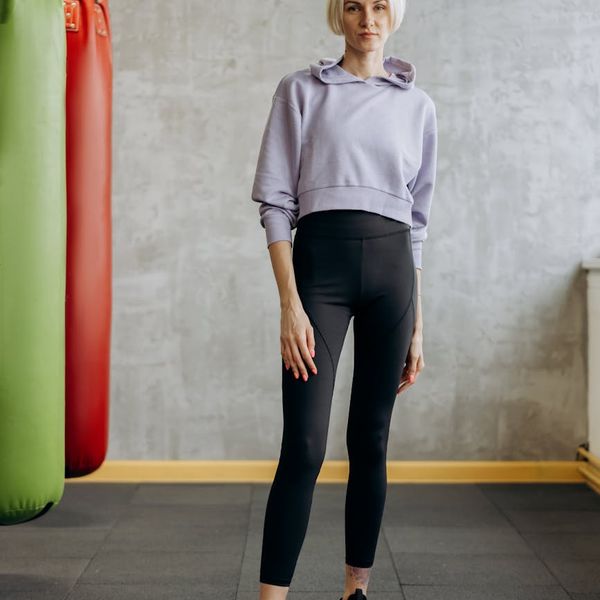 Portrait of a smiling fitness instructor in sportswear.